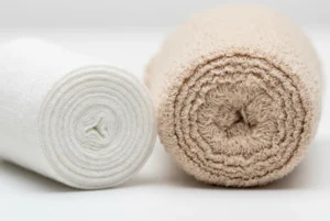 side by side comparison of PBT bandage vs crepe bandage texture and elasticity